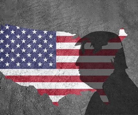 illustratie: silhouet van Trump, grondgebied en vlag VS op een betonnen wand